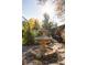 Outdoor fountain in the backyard garden with nearby plants and trees at 4269 Carter Trl, Boulder, CO 80301