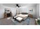 Serene bedroom features a neutral color palette, modern furniture, and abundant natural light at 3908 N Riviera Ct, Aurora, CO 80019