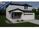 New two-story home with attached two-car garage and covered porch, in the process of being built at 3908 N Riviera Ct, Aurora, CO 80019