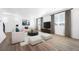 Spacious living room with hardwood floors, neutral furniture, and lots of natural light at 3908 N Riviera Ct, Aurora, CO 80019