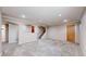 Large carpeted basement space with recessed lighting and access to stairs at 3387 S Pitkin Way, Aurora, CO 80013