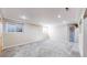 Spacious carpeted basement area with two windows providing natural light at 3387 S Pitkin Way, Aurora, CO 80013