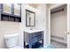 Bathroom featuring a vanity with storage and a mirror, with blue tiled floor at 3387 S Pitkin Way, Aurora, CO 80013