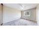 Inviting bedroom with a ceiling fan and a window offering natural light at 3387 S Pitkin Way, Aurora, CO 80013