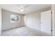 Bright bedroom with neutral walls, ceiling fan, carpet, and a large window at 3387 S Pitkin Way, Aurora, CO 80013