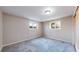 Bedroom featuring plush carpeting and two windows at 3387 S Pitkin Way, Aurora, CO 80013