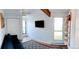 Sun-filled room offering closet space, a mounted TV, and a full wall of windows at 3209 Redstone Rd # 12B, Boulder, CO 80305