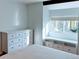Bright bedroom features a large white dresser, built in shelving, and lots of natural light at 3209 Redstone Rd # 12B, Boulder, CO 80305