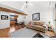 Open-concept living area featuring hardwood floors, dining area, and sun-filled windows at 3209 Redstone Rd # 12B, Boulder, CO 80305