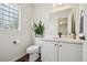 Clean bathroom with modern sink and faucet, updated vanity, and natural lighting at 4520 Maroon Cir, Broomfield, CO 80023