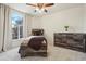 Cozy bedroom with rustic furniture, a large window, and neutral tones at 4520 Maroon Cir, Broomfield, CO 80023
