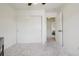Clean bedroom with closet, large window, and neutral carpeting at 4520 Maroon Cir, Broomfield, CO 80023