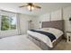 Cozy bedroom with soft carpet, natural light, and stylish decor at 4520 Maroon Cir, Broomfield, CO 80023