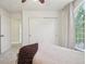 Bright bedroom with a closet and large window, showcasing neutral decor at 4520 Maroon Cir, Broomfield, CO 80023
