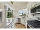 Bright kitchen features stainless steel appliances, stone countertops, and a picturesque window at 4520 Maroon Cir, Broomfield, CO 80023