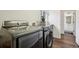 Well-equipped laundry room with modern washer and dryer units, and ample counter space at 4520 Maroon Cir, Broomfield, CO 80023