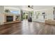 Open living space with fireplace, wood floors, and seamless flow to the kitchen and outdoor area at 4520 Maroon Cir, Broomfield, CO 80023