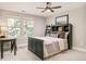 This is a spacious bedroom with two windows and a dark green headboard with storage at 3502 Birch Ave, Parker, CO 80134