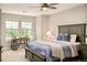 Comfortable bedroom featuring a ceiling fan, desk, and abundant natural light at 3502 Birch Ave, Parker, CO 80134
