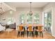 Bright dining area features wood floors, modern lighting, and access to outdoor living at 3502 Birch Ave, Parker, CO 80134