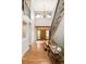 Grand two-story foyer with hardwood floors and elegant staircase for a welcoming entrance at 3502 Birch Ave, Parker, CO 80134