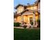 Inviting brick front porch features craftsman columns, neutral paint, and decorative wreath at 3502 Birch Ave, Parker, CO 80134