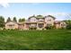 Beautiful two-story brick home features manicured lawn and well-maintained landscaping at 3502 Birch Ave, Parker, CO 80134