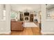 Comfortable living room featuring a fireplace, built-in bookshelves and hardwood flooring at 3502 Birch Ave, Parker, CO 80134