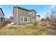 Exterior of home highlighting the wooden deck, landscaping, and grassy backyard at 5531 Fox Meadow Ave, Highlands Ranch, CO 80130