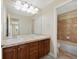 Bathroom featuring large vanity with double sinks, large mirror and adjacent shower/toilet room at 5531 Fox Meadow Ave, Highlands Ranch, CO 80130