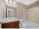 Bathroom features a shower over tub and a wooden vanity at 5531 Fox Meadow Ave, Highlands Ranch, CO 80130