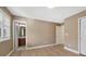 Bedroom showcasing a glimpse of the bathroom, wood-look floors, and neutral paint at 5531 Fox Meadow Ave, Highlands Ranch, CO 80130
