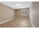 Bedroom featuring a window with shutter blinds and wood-look floors at 5531 Fox Meadow Ave, Highlands Ranch, CO 80130