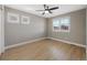 Comfortable bedroom featuring modern ceiling fan, natural light and wood-look flooring at 5531 Fox Meadow Ave, Highlands Ranch, CO 80130