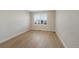 Cozy bedroom with wood-look flooring and a window offering ample natural light at 5531 Fox Meadow Ave, Highlands Ranch, CO 80130