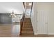 Entryway with staircase featuring wood banisters, hardwood floors, and an open floor plan at 5531 Fox Meadow Ave, Highlands Ranch, CO 80130