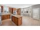 Bright kitchen featuring stainless steel appliances, wood cabinets, granite counters, and island with lots of windows at 5531 Fox Meadow Ave, Highlands Ranch, CO 80130