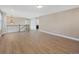 Bright living room showcasing wood floors, staircase, and ample natural light in neutral color palette at 5531 Fox Meadow Ave, Highlands Ranch, CO 80130
