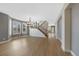 Spacious living room featuring hardwood floors, large windows, and a modern chandelier at 5531 Fox Meadow Ave, Highlands Ranch, CO 80130