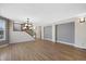 Spacious open-concept living area with hardwood floors and staircase at 5531 Fox Meadow Ave, Highlands Ranch, CO 80130