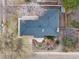 Aerial view of a single-Gathering house shows the roof, yard with mature trees, and surrounding neighborhood at 5743 Field St, Arvada, CO 80002