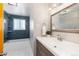 Bathroom featuring shower over tub and single vanity at 5743 Field St, Arvada, CO 80002