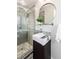 Modern bathroom with walk-in shower, sleek vanity, and decorative tile at 5743 Field St, Arvada, CO 80002
