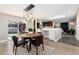 The dining room has an eye-catching light fixture and connects to both the kitchen and patio at 5743 Field St, Arvada, CO 80002