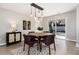 Dining room features wood floors, stylish lighting, and access to the backyard patio at 5743 Field St, Arvada, CO 80002