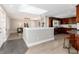 Bright and airy kitchen featuring sleek cabinetry, stainless steel appliances, and an adjacent dining area with modern lighting at 5743 Field St, Arvada, CO 80002