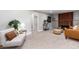 Cozy living room with exposed brick, fireplace and neutral decor at 5743 Field St, Arvada, CO 80002