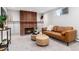 Living room boasts a brick fireplace, carpet, and seating area at 5743 Field St, Arvada, CO 80002