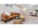 Bright living room area with stylish seating and a carpet, offering a comfortable space at 5743 Field St, Arvada, CO 80002