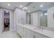 Spacious bathroom features a double vanity, large mirror, and a glass-enclosed shower at 10344 Vienna St, Parker, CO 80134